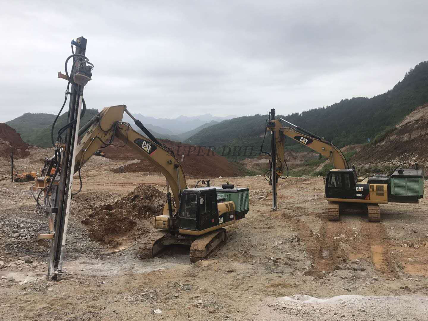 Excavator mounted rock drills